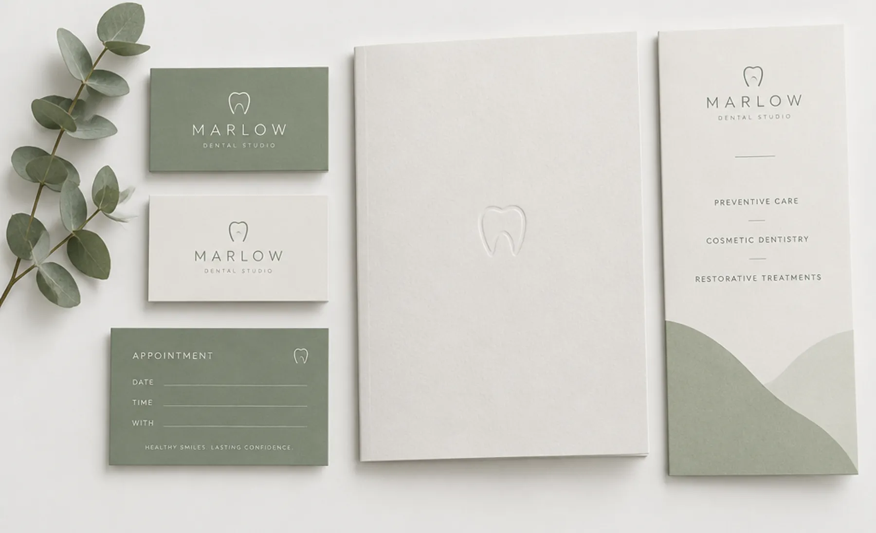 Example branding for an invented dental practice, Marlow Dental Studio: sage and cream business cards with a minimal tooth mark, an appointment card, a debossed folder and a service brochure